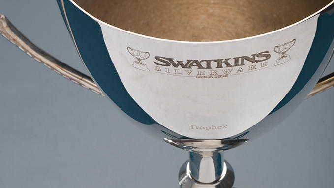 Engraving onto a cup of a sponsor's logo or the name of an event