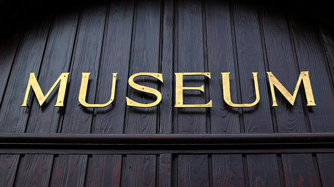 Architectural signage: museum sign with cut-out metal letters