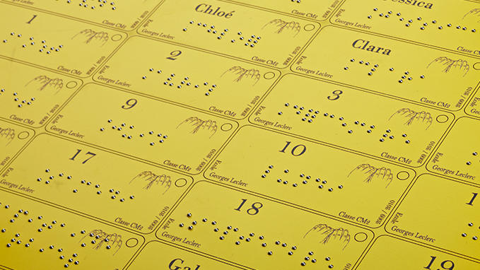 Engraving of badges and labels in Braille